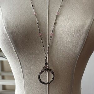1928 Silver-Tone Magnifying Glass Necklace with Pink Crystal Accents